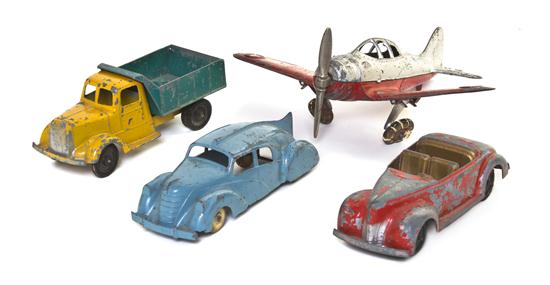 A Collection of Four Pressed Metal Toys