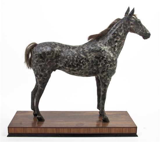A Carved and Cast Model of a Horse depicted