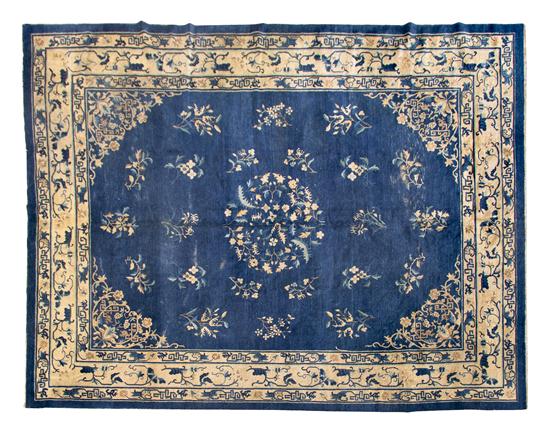 A Chinese Wool Rug centered with