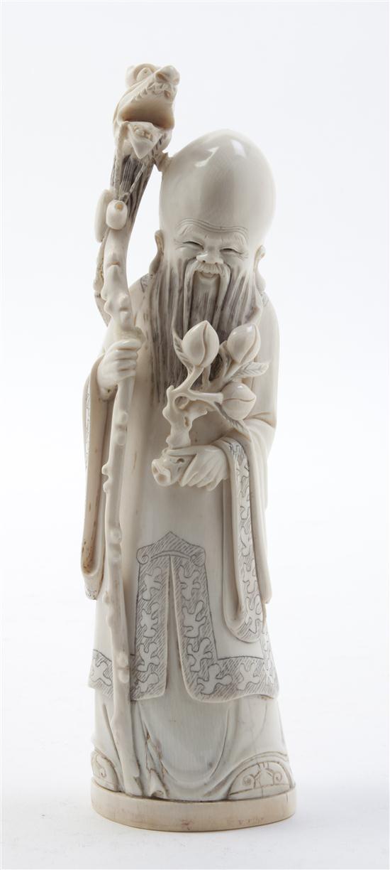 A Chinese Carved Ivory Figure of