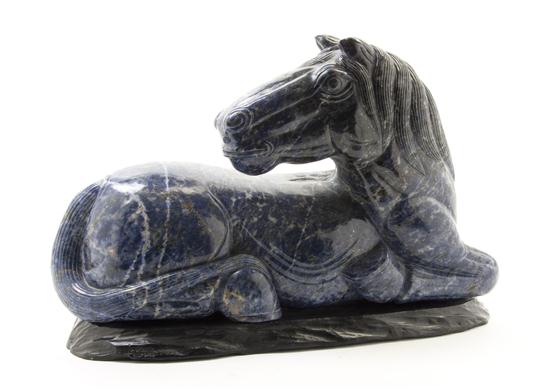 A Lapis Carved Horse depicted kneeling