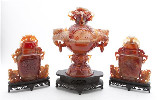 A Carved Carnelian Urn and Vases each