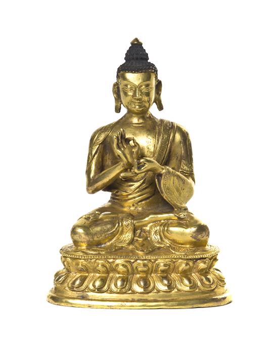 A Gilt Bronze Model of a Buddha depicted