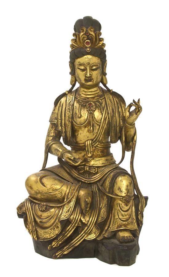 A Gilt Bronze Statue of Guanyin depicted