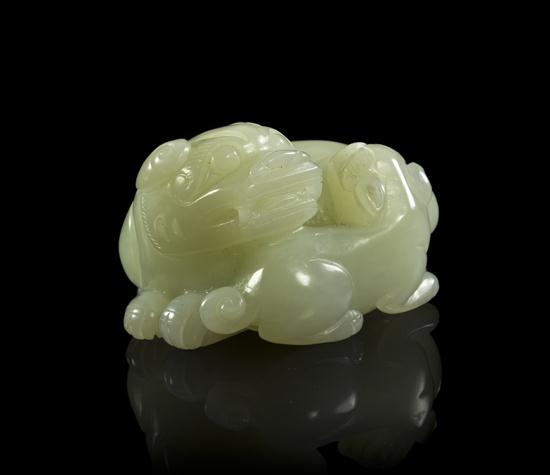 A White Jade Carving of a Lion and Pup