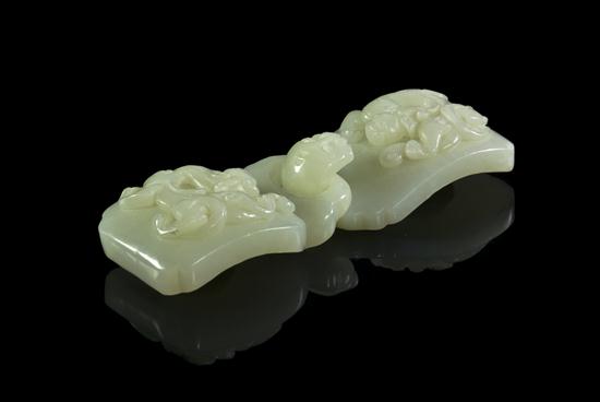 A Carved Jade Belt Buckle of pale 154308