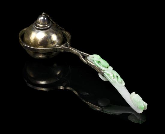 A Jadeite Belthook and Silver Mounted