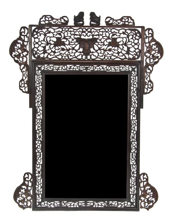 A Chinese Carved Wood Mirror having 15431e