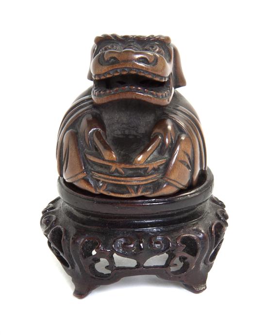 A Carved Wood Netsuke depicting 1543a2