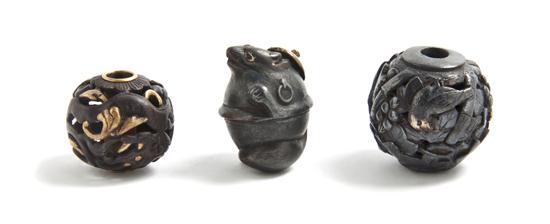 Three Ojime comprising a badger a dragon