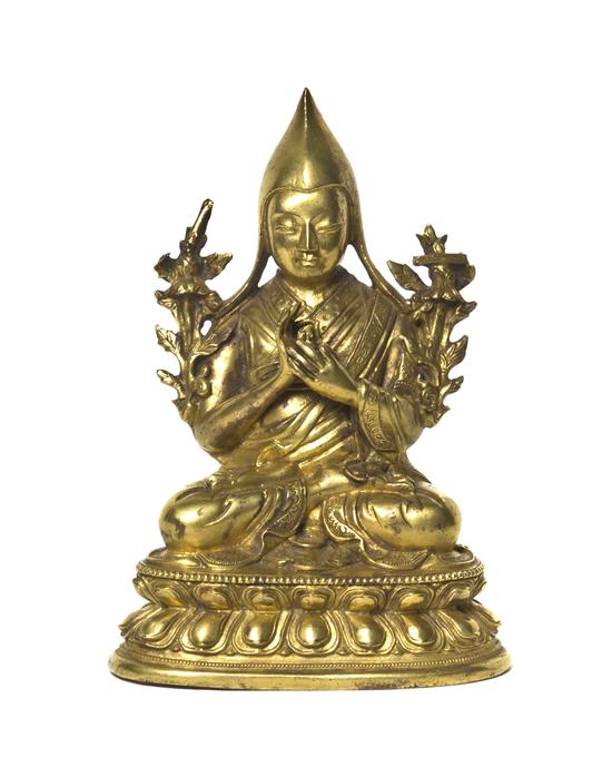 A Gilt Bronze Model of a Buddhist