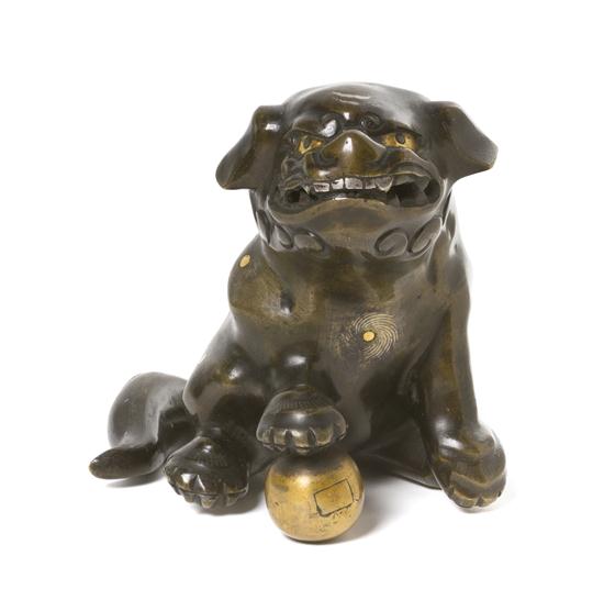A Chinese Bronze Pup having gold