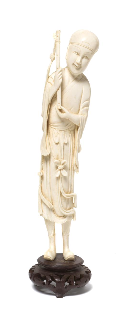 A Chinese Carved Ivory Musician depicted