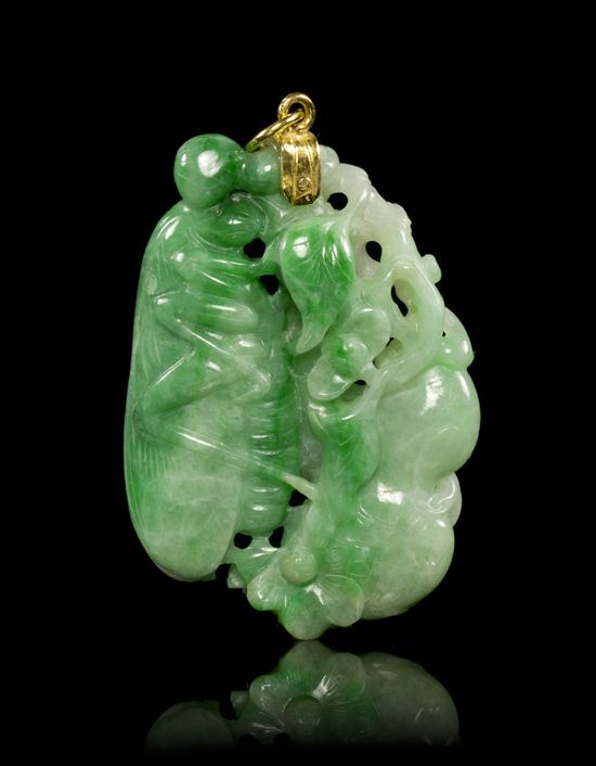 A Carved Jadeite Pendant of green