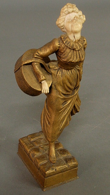 Bronze figure of a woman carrying a