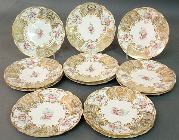 Twelve Limoges china service plates.