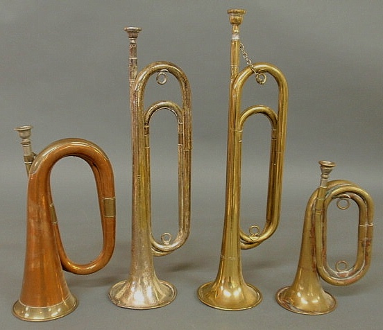 Four brass bugles including an official