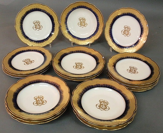 Ten gilt and blue service plates and