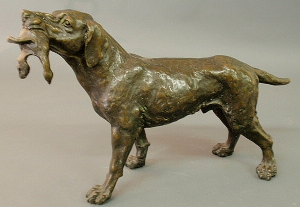 Bronze of a hunting dog with game