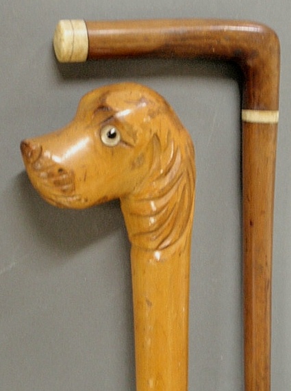 Cane with carved maple dog head with