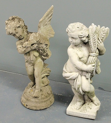 Two cast stone garden statues of