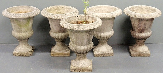 Five concrete garden urns stamped