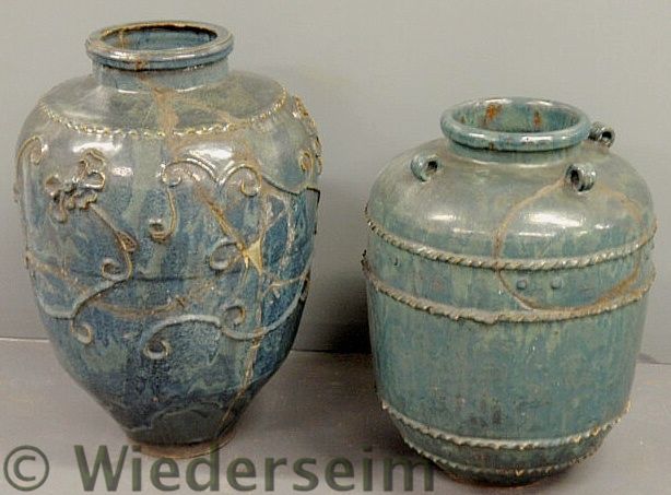 Two similar large earthenware jars