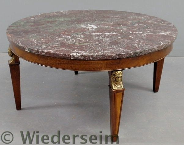 Round mahogany coffee table with a marble