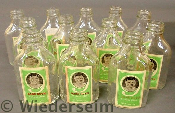 Twelve glass bottles with paper 15762d