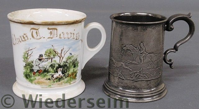 Pewter mug with a raised relief