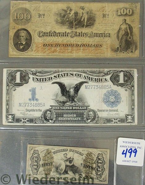 Three pieces of U.S. currency-