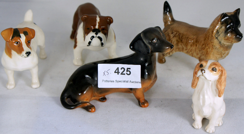 A collection of Beswick Dogs to include