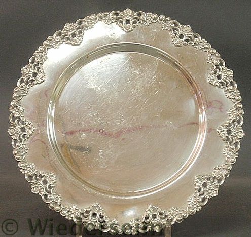 Round sterling silver tray with a chased