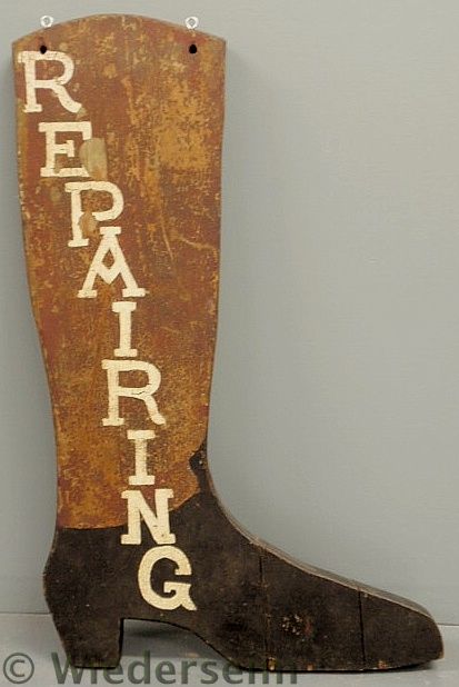 Carved boot trade sign "Repairing"