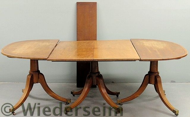 Inlaid mahogany dining table with a