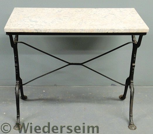 Cast iron patio table with a marble