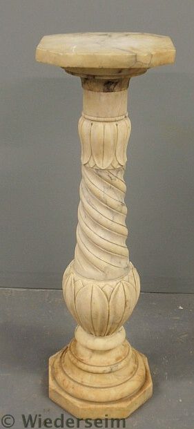 Marble pedestal with a rotating top