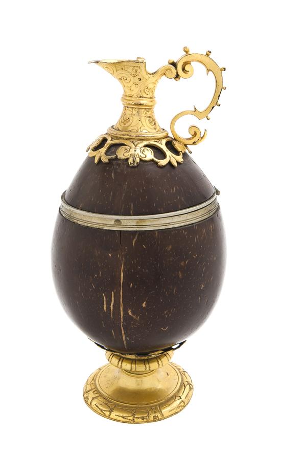 *A Gilt Metal Mounted Coconut Ewer