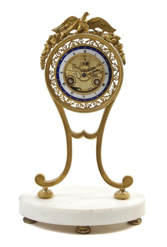 A French Gilt Bronze and Marble Clock