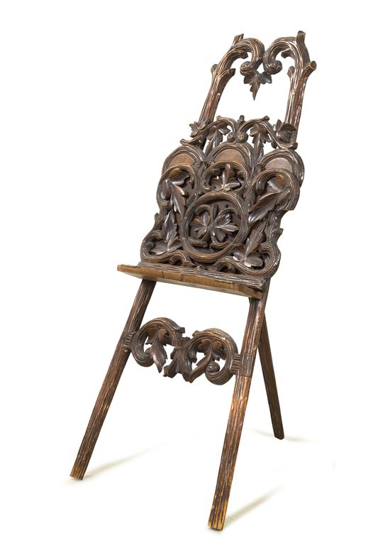 *A Black Forest Style Carved Easel of