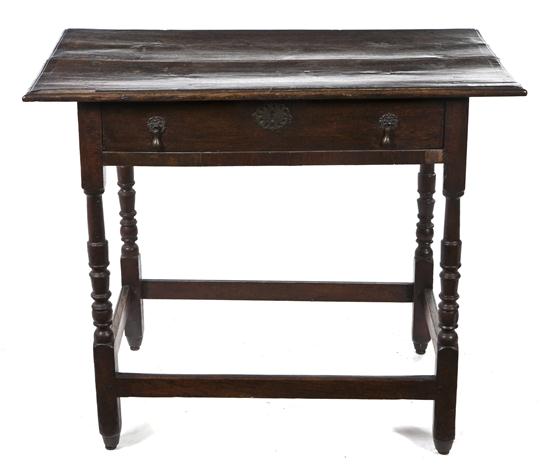 *An English Oak Occasional Table having