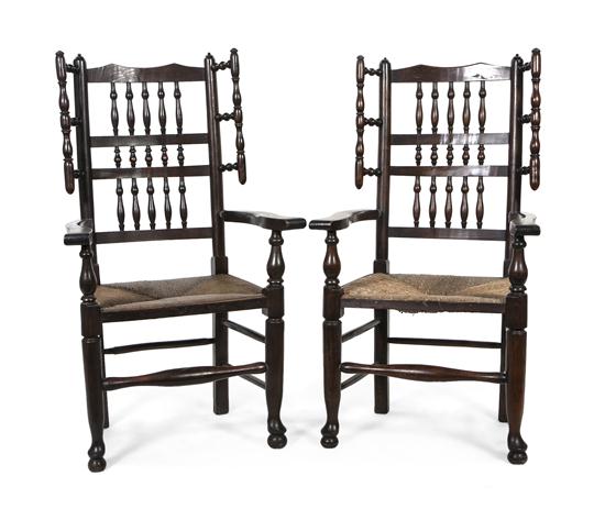 *A Pair of English Oak Open Armchairs