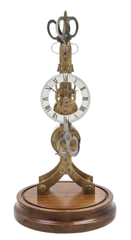 A Brass Skeleton Clock having twin