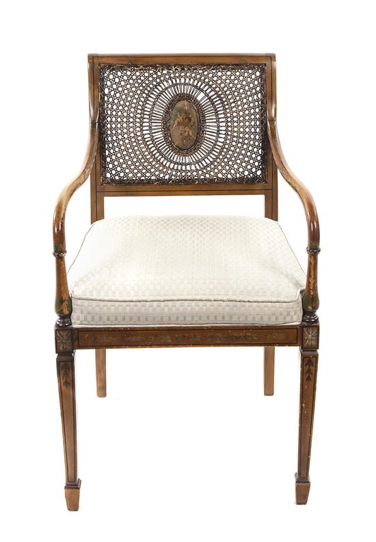 *An English Open Armchair having a caned