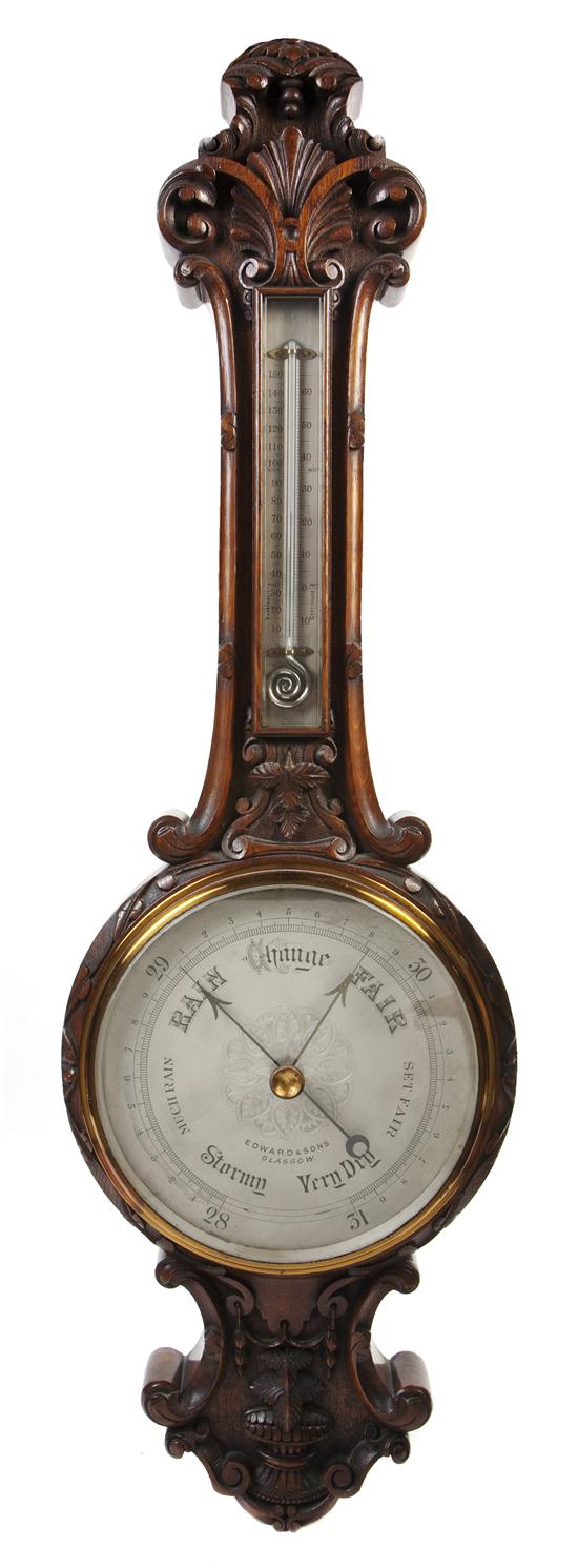A Scottish Carved Mahogany Wheel Barometer