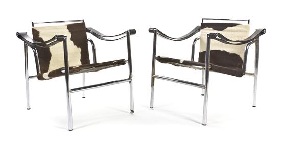 A Pair of Basculant Armchairs attributed