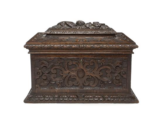 A Carved Oak Tea Caddy having a 156155