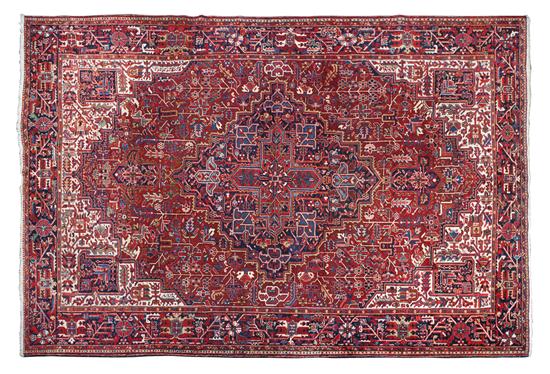 A Heriz Wool Rug having a central 156188