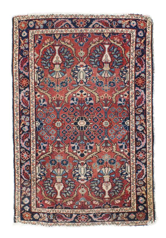 A Collection of Five Persian Rugs