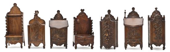 A Collection of Seven Carved Wood